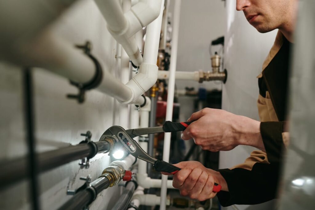 Plumbers maintaining commercial plumbing pipes in Tarpon Springs